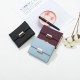 Prettyzys' popular Korean-style short, tri-folded women's wallet, a fresh, PU, ​​plaid, and zippered student wallet.
