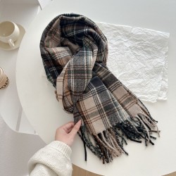 A new winter women's scarf with a wave pattern and tassels a high-end versatile and warm scarf. A new winter women's scarf with a wave pattern and tassels a high-end versatile and warm scarf.