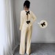 Women's suit with a hollowed-out bow at the back, 2025 summer elegant round-neck long-sleeved top and trousers, two-piece set.