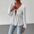 Elegant long-sleeved top, blouse. Loose-fitting V-neck, ruffled hem, contrasting lace-up design for a slimming, versatile shirt.