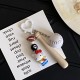 Homemade creative table tennis, badminton, KT doll keychain, cartoon sports game racket series bag charm for couples.