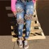 Factory direct sales: European and American ripped women's jeans, personalized leopard print, high-waisted Women's Pants