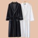 New autumn and winter coral fleece pajamas for men and women, thickened fleece couple's nightgown with pants for winter warmth.