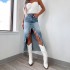 Amazon cross-border 2025 Spring new high-waisted, irregular, raw-edge denim skirt for women, distressed and washed.