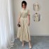 European and American women's polka-dot retro short-sleeved maxi dresses with a belt and decorative buckle for a slimming, fashionable dress.