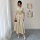 European and American women's polka-dot retro short-sleeved maxi dresses with a belt and decorative buckle for a slimming, fashionable dress.