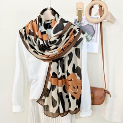 New European and American leopard print bow-knotted long scarves, versatile, high-end thin outerwear shawls for women, wholesale.