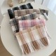 A versatile pink dotted plaid scarf for autumn and winter, perfect for couples, with a tasseled design for warmth.