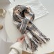 A versatile pink dotted plaid scarf for autumn and winter, perfect for couples, with a tasseled design for warmth.