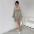 Slightly flared long-sleeved knit dress for women, 2025 autumn and winter French high-end V-neck, waisted A-line short skirt.