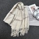 A new cross-border thickened plaid scarf for autumn and winter, soft and whitening, and a faux cashmere scarf with tassels, ready for wholesale.