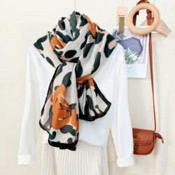 New European and American leopard print bow-knotted long scarves versatile high-end thin outerwear shawls for women wholesale. New European and American leopard print bow-knotted long scarves versatile high-end thin outerwear shawls for women wholesale.