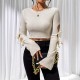 2025 autumn hollow knot side tie flared sleeve T-shirt for women. Knitted, ladylike, slim-fitting long-sleeved top.